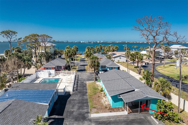 bird's eye view featuring a residential view and a water view