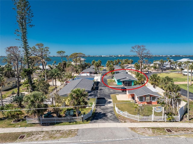 birds eye view of property with a water view