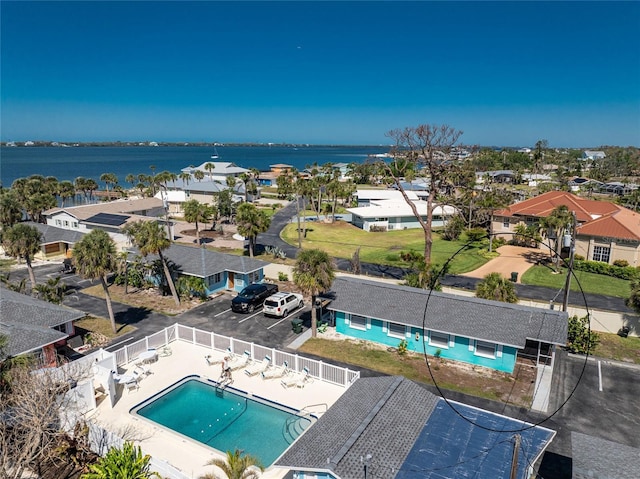 birds eye view of property with a residential view and a water view