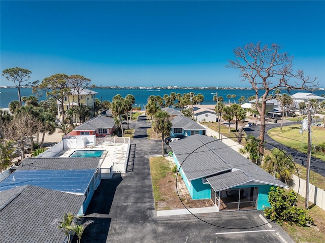 birds eye view of property with a water view and a residential view