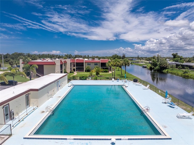 view of pool featuring a water view