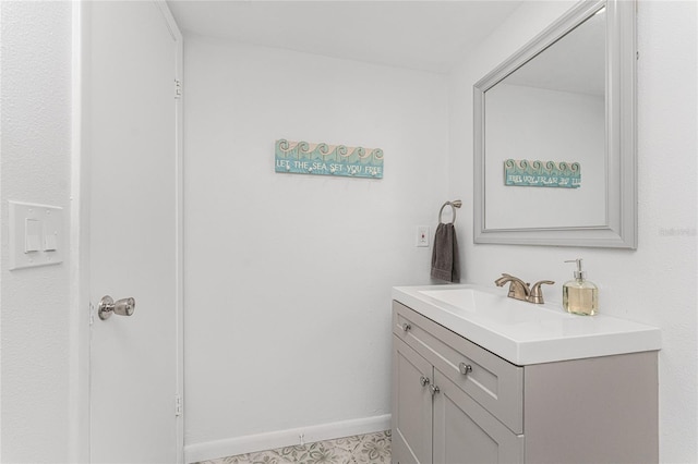 bathroom with tile patterned flooring and vanity