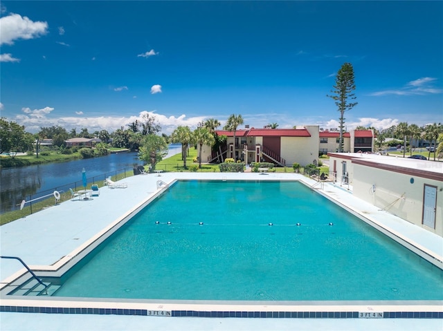 view of pool with a water view