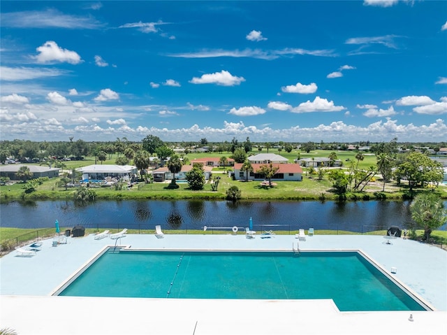 view of pool featuring a water view