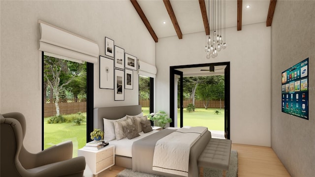 bedroom with lofted ceiling with beams, an inviting chandelier, and light hardwood / wood-style floors