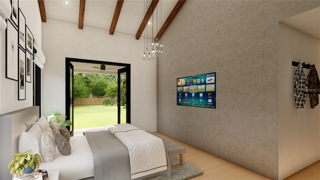 bedroom with vaulted ceiling and light wood-type flooring