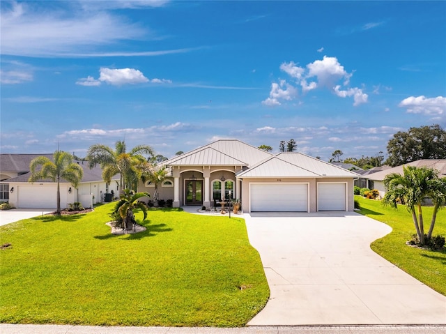 view of front facade with a front yard and a garage