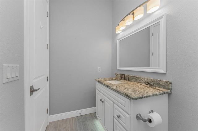 bathroom with vanity and hardwood / wood-style floors