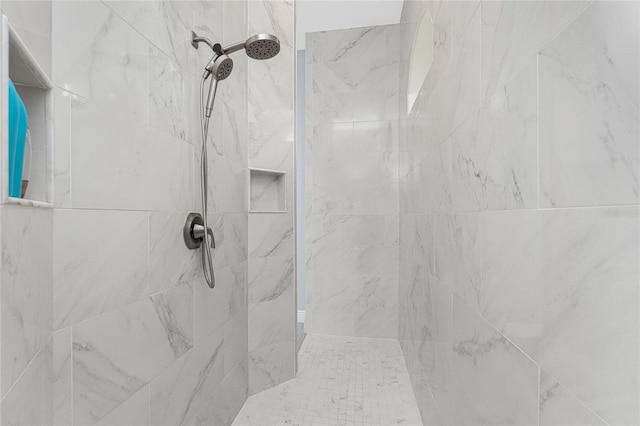 bathroom featuring tiled shower