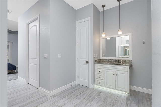 bathroom with vanity and hardwood / wood-style flooring