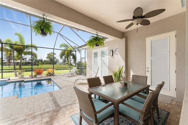 view of pool featuring a patio, a lanai, and ceiling fan