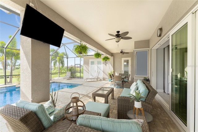 view of patio featuring outdoor lounge area, a lanai, and ceiling fan