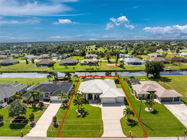 birds eye view of property featuring a water view