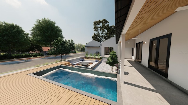 view of swimming pool featuring a patio area and a jacuzzi