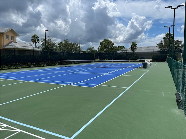 view of sport court featuring basketball hoop