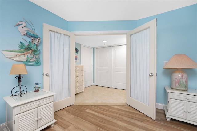 corridor featuring light hardwood / wood-style floors