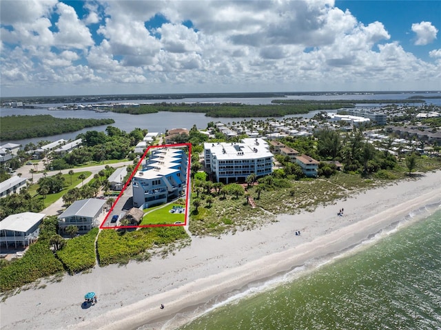 bird's eye view with a beach view and a water view