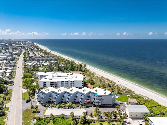 drone / aerial view with a water view and a view of the beach