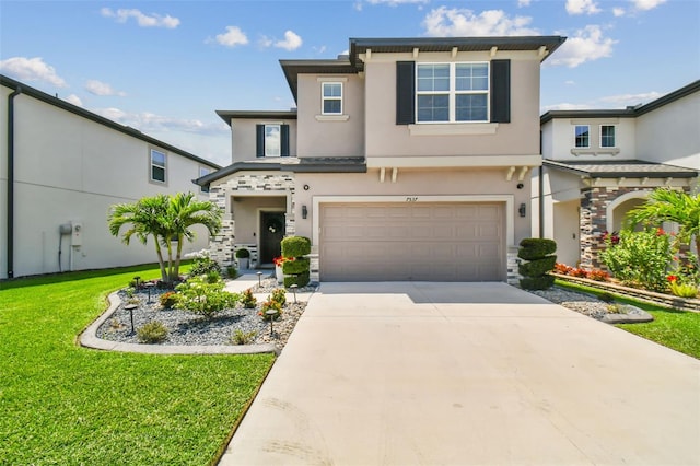 view of front of home with a garage and a front yard