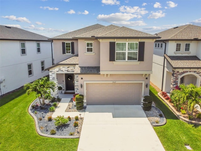 view of front of home featuring stucco siding, driveway, a front yard, a shingled roof, and a garage