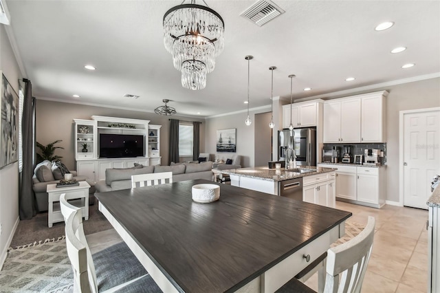 dining area featuring recessed lighting, visible vents, a notable chandelier, and ornamental molding