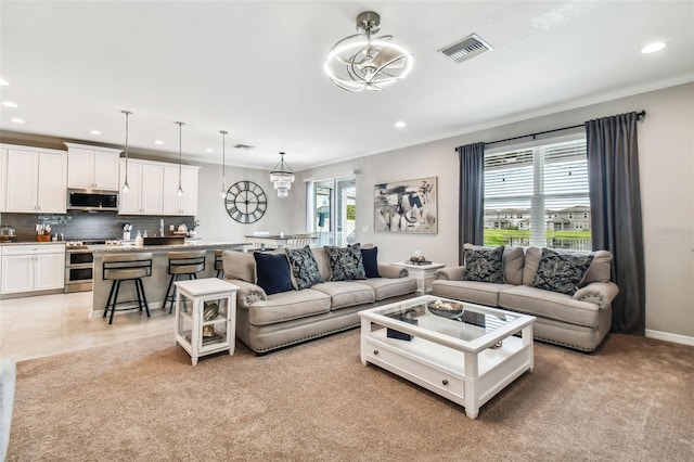 living room featuring visible vents, recessed lighting, crown molding, and baseboards