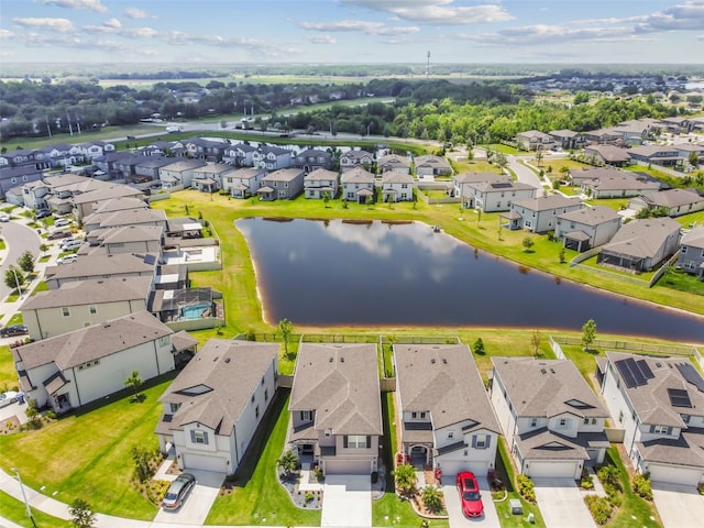 aerial view featuring a residential view and a water view