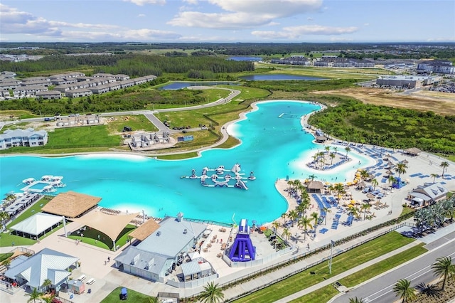 birds eye view of property with a water view