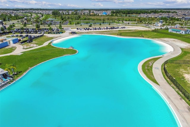 view of pool featuring a water view