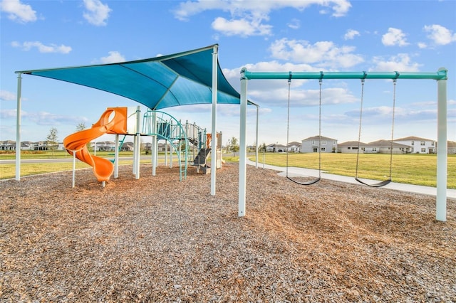 communal playground featuring a lawn