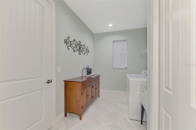 clothes washing area with independent washer and dryer