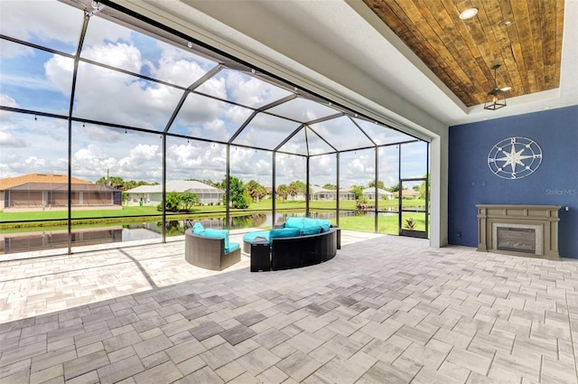 view of patio / terrace featuring glass enclosure