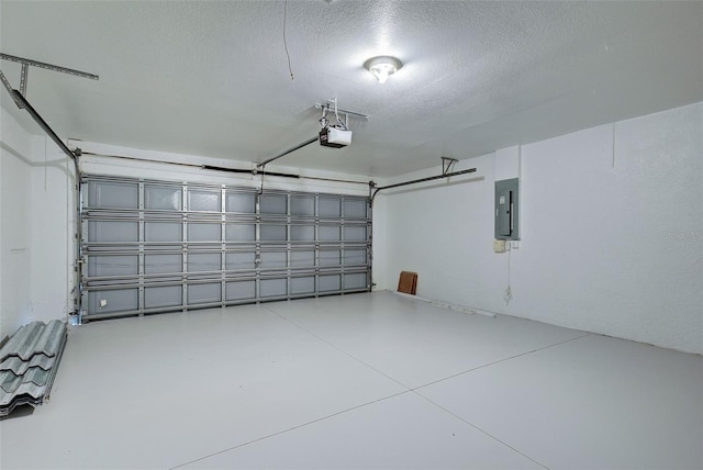 garage featuring electric panel and a garage door opener