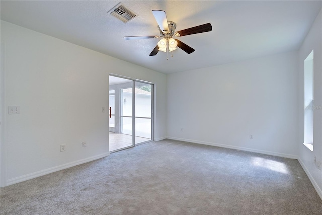 unfurnished room with ceiling fan and light colored carpet