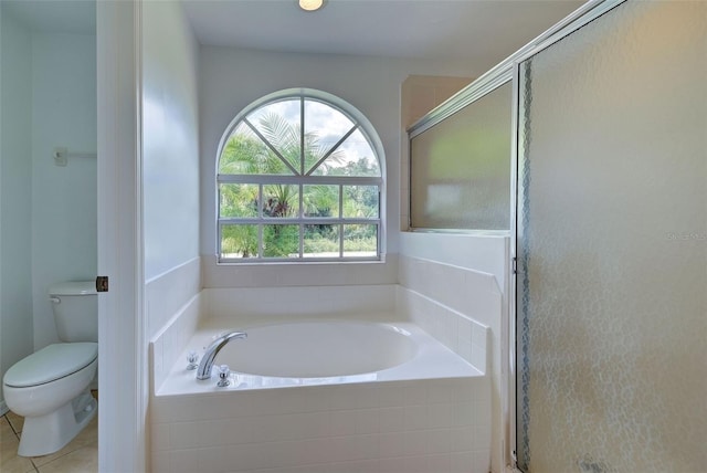 bathroom featuring independent shower and bath, toilet, and tile patterned floors