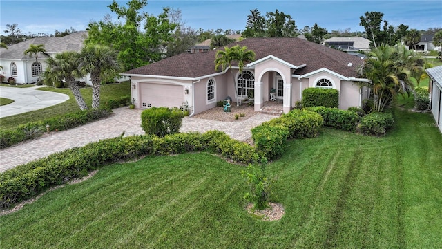 view of front facade featuring a garage and a front yard