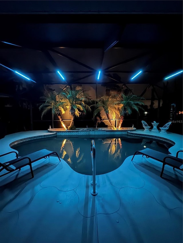 view of pool at night