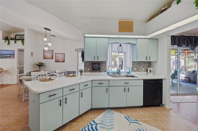 kitchen with black dishwasher, light tile patterned floors, sink, decorative backsplash, and lofted ceiling