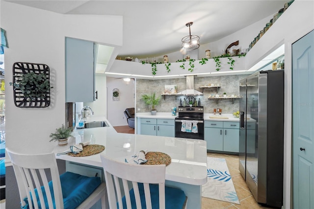 kitchen featuring stainless steel appliances, sink, wall chimney exhaust hood, kitchen peninsula, and a kitchen bar