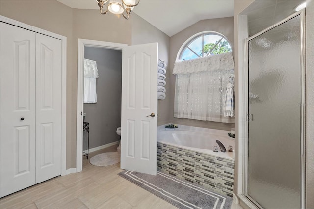 bathroom featuring independent shower and bath, toilet, and vaulted ceiling