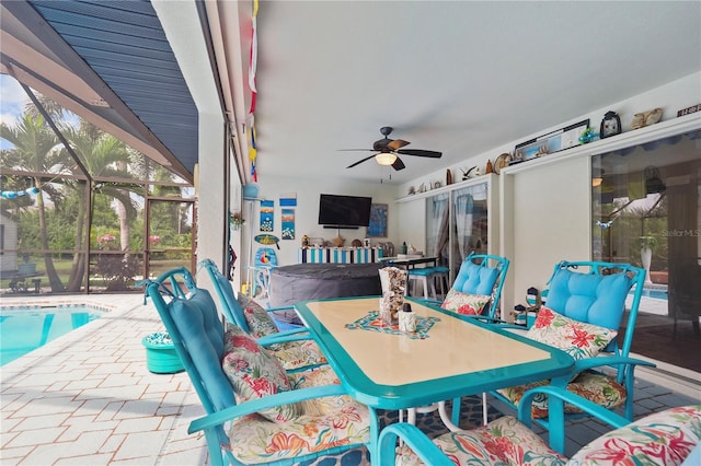 view of patio / terrace with a lanai and ceiling fan