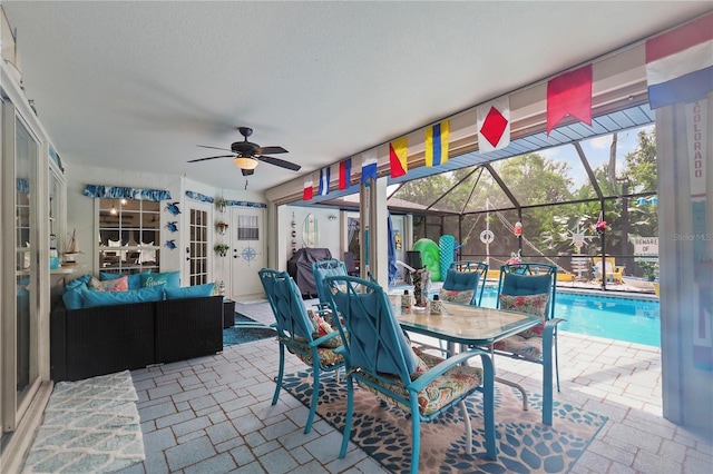 exterior space with a swimming pool and ceiling fan