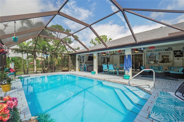 view of pool featuring a lanai and a patio