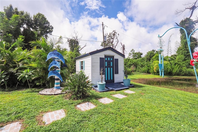 view of outdoor structure featuring a yard