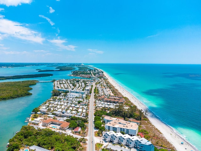 bird's eye view featuring a water view and a beach view