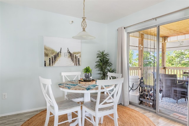 dining space featuring hardwood / wood-style floors