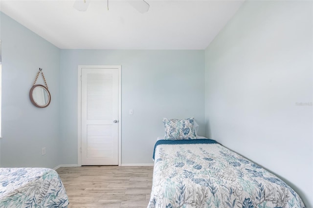 bedroom featuring ceiling fan and light hardwood / wood-style flooring