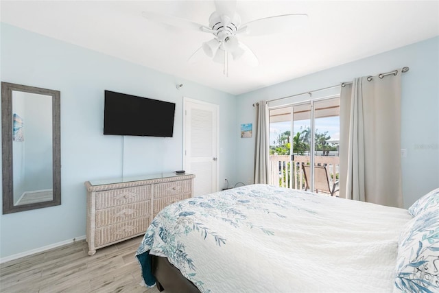 bedroom featuring light hardwood / wood-style flooring, ceiling fan, and access to outside