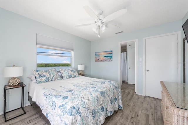 bedroom featuring ceiling fan and light hardwood / wood-style floors