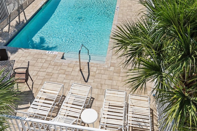 view of pool featuring a patio area